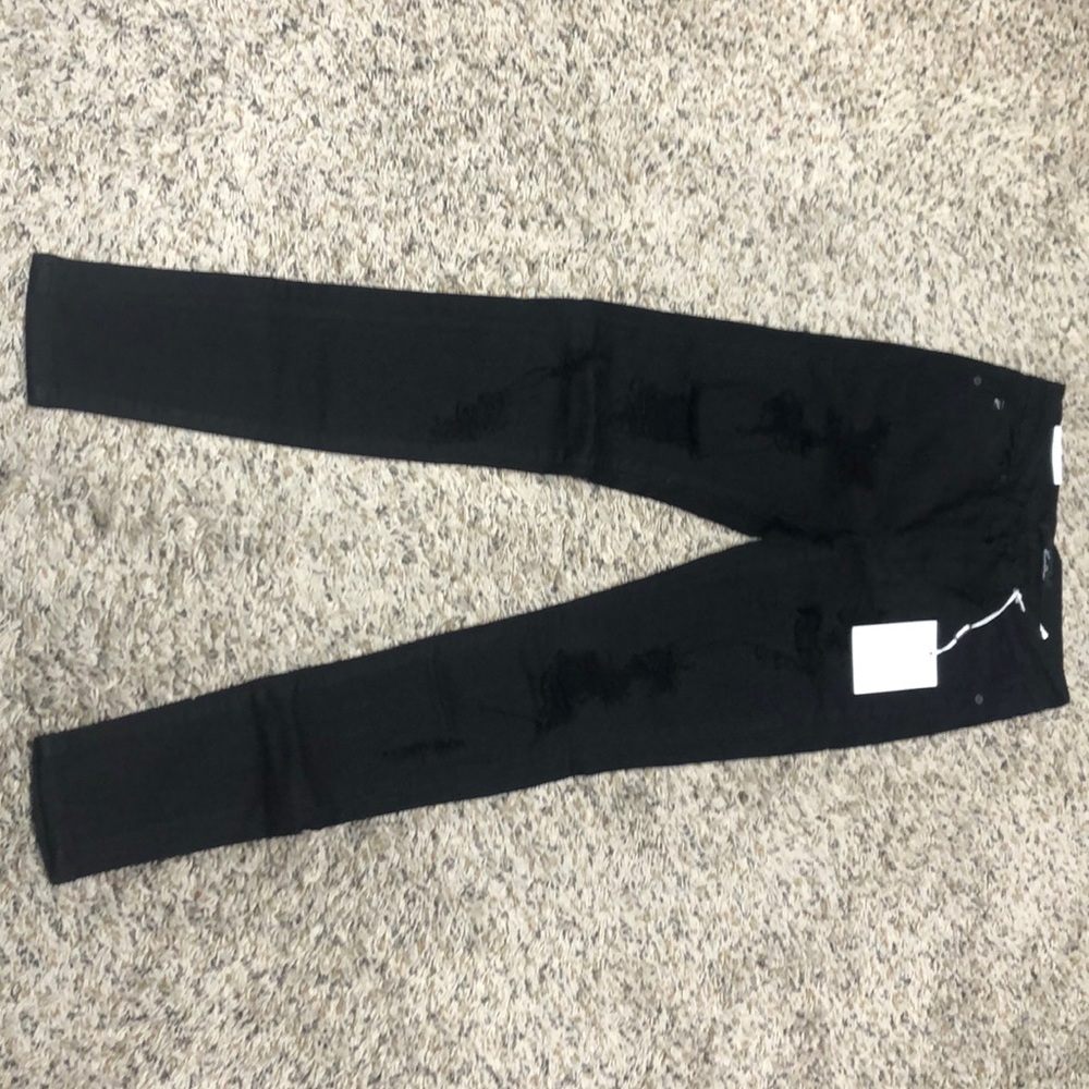 High rise black destroyed detail skinny jeans